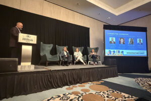 A panel discussion titled "Connected Corridor: Powering the Austin–San Antonio Mega-Region" at the Austin Chamber Infrastructure Summit, held at the Hilton Austin.